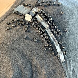 Grey t-shirt with beautiful sparkly gemstones sewn in shoulder